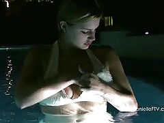 Danielle plays in the pool at night