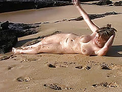 Danielle plays in the sand and surf